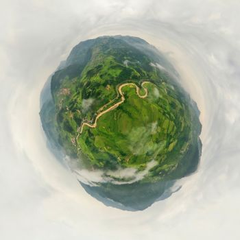 Little planet 360 degree sphere. Panorama of paddy rice terraces, green agricultural fields in rural area of Mu Cang Chai, mountain hills valley, Vietnam. Nature landscape background.
