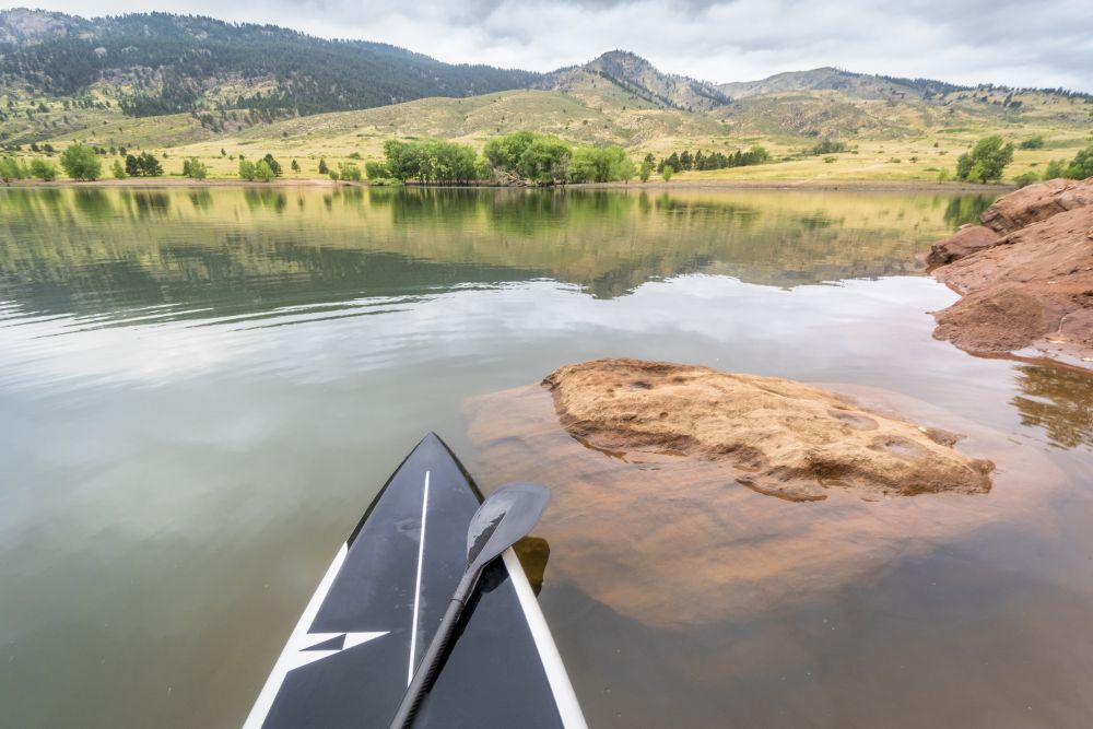 stand up paddleboard on a mountain lake - Horsetooth Reservoir in northern Colorado