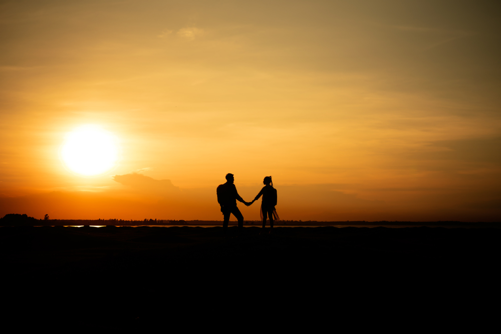 Silhouette traveler couples walking  on mountain at sunset times. Silhouette traveler couples walking