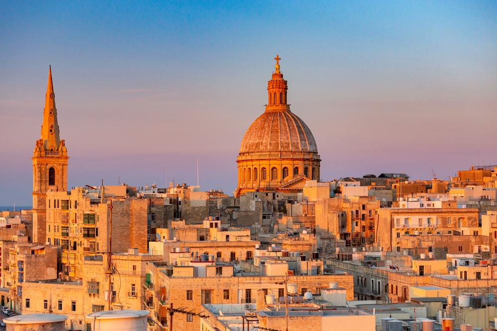 The Cathedral of St. John and the old city at sunset. Malta. Valletta.. Malta. Valletta. Cathedral of St. John at sunset.