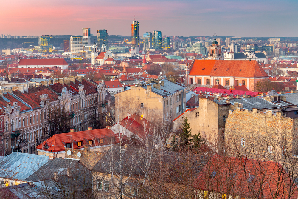 Scenic aerial view of the city at sunset. Vilnius. Lithuania.. Vilnius. Lithuania. Aerial view of the city at sunset.