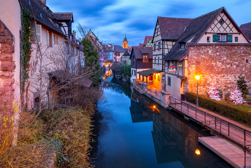 Scenic view of old medieval houses on the canal at sunset. Colmar. Alsace France.. Colmar. France. Old houses on the canal.