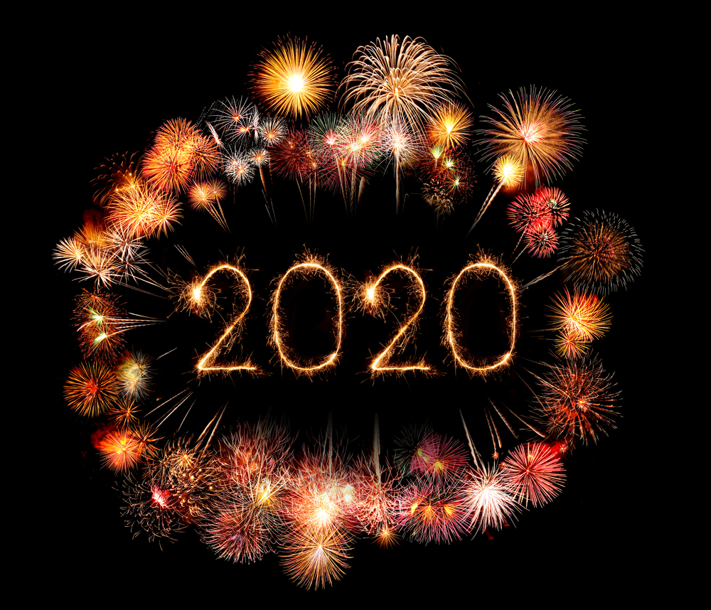 2020 happy new year fireworks written sparkling sparklers at night
