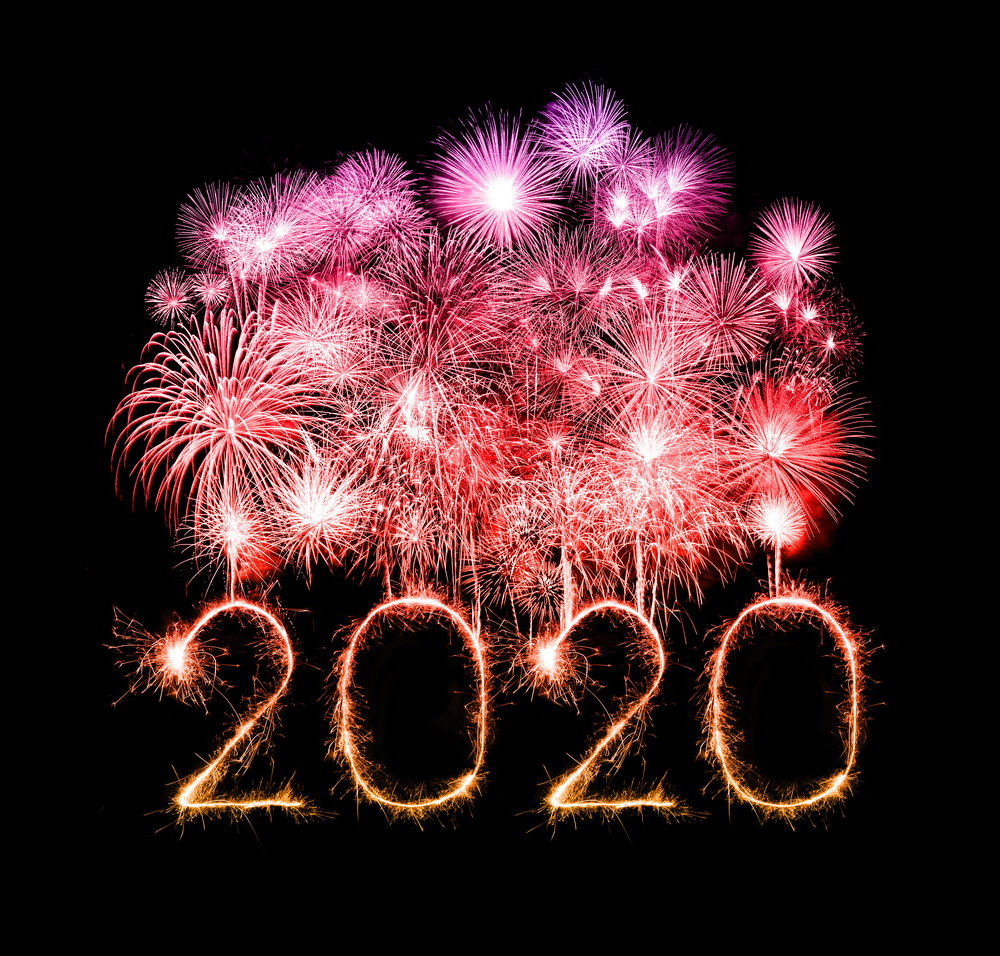 2020 happy new year fireworks written sparkling sparklers at night