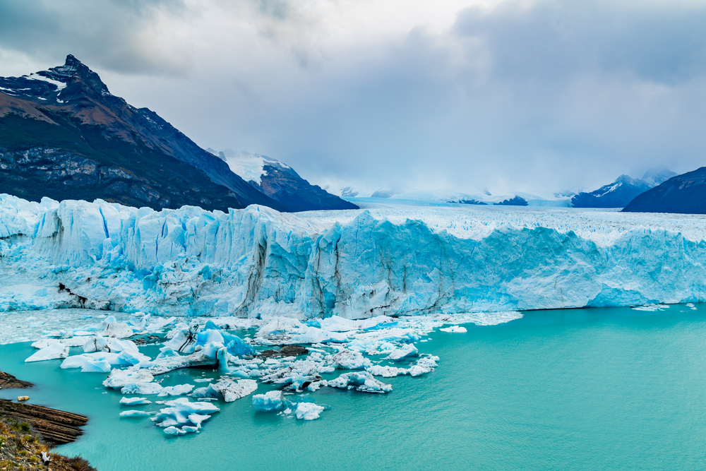View of Perito Moreno Glacier with Iceberg floating in Argentina lake in Los Glaciares National Park Argentina Patagonia