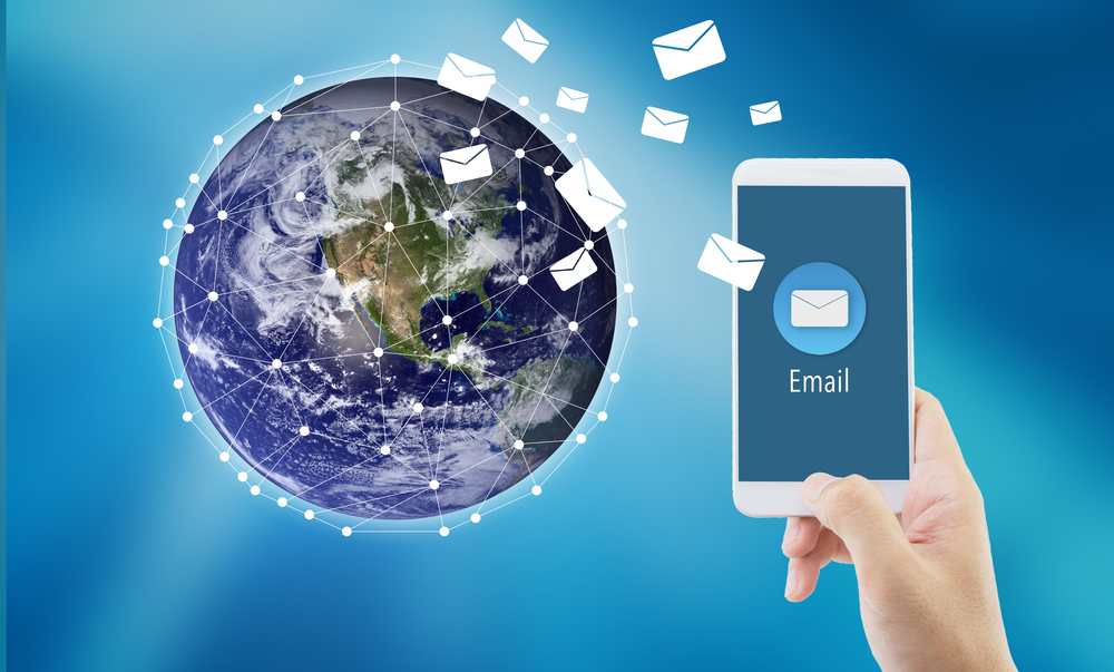 Hand holding man check and sending message with email in a phone on world background, communication concept, Elements of this image furnished by NASA.