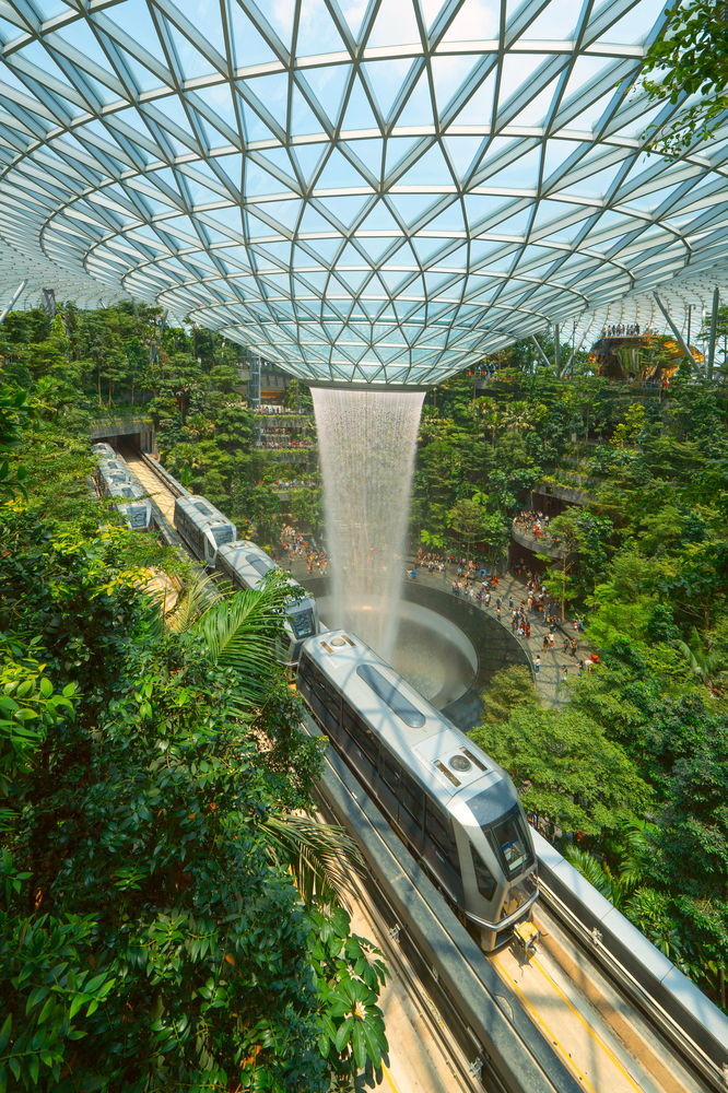 Jewel Changi Airport in Singapore City. Interior design decoration with waterfall, garden and trees. The world&rsquo;s best airport and destination