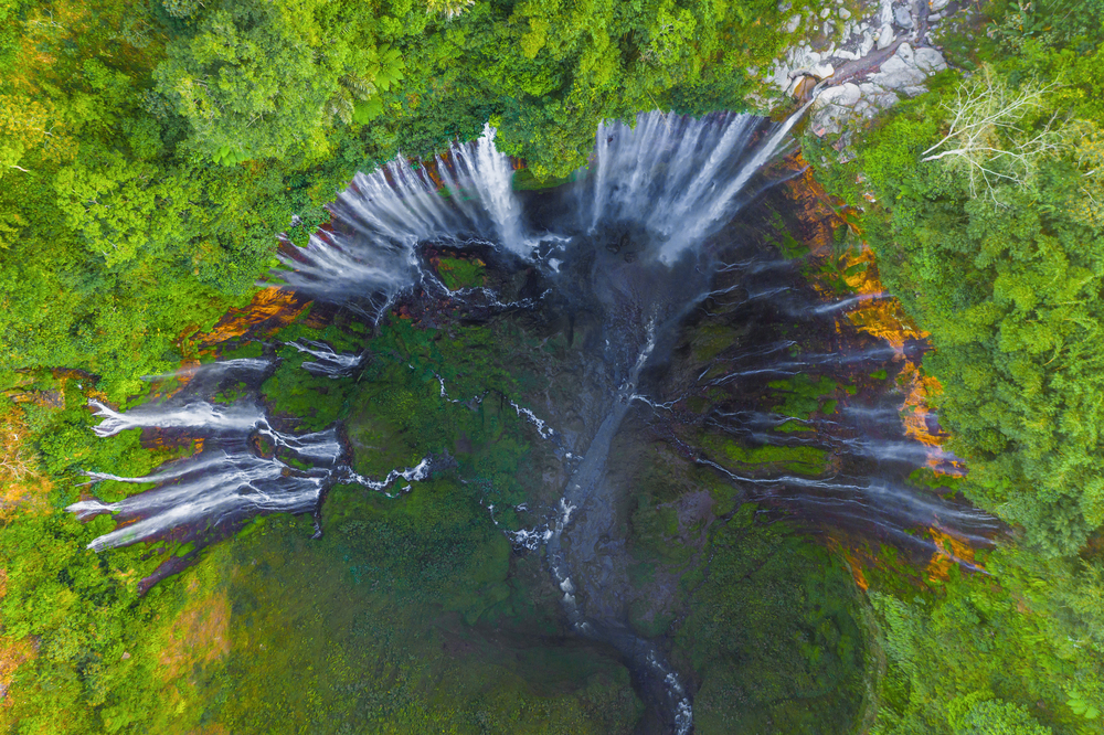 Aerial top view of Sewu Waterfall. Nature landscape of Jinguashi in natural area. it is located in Indonesia for travel trip background, tourist attraction. Top view