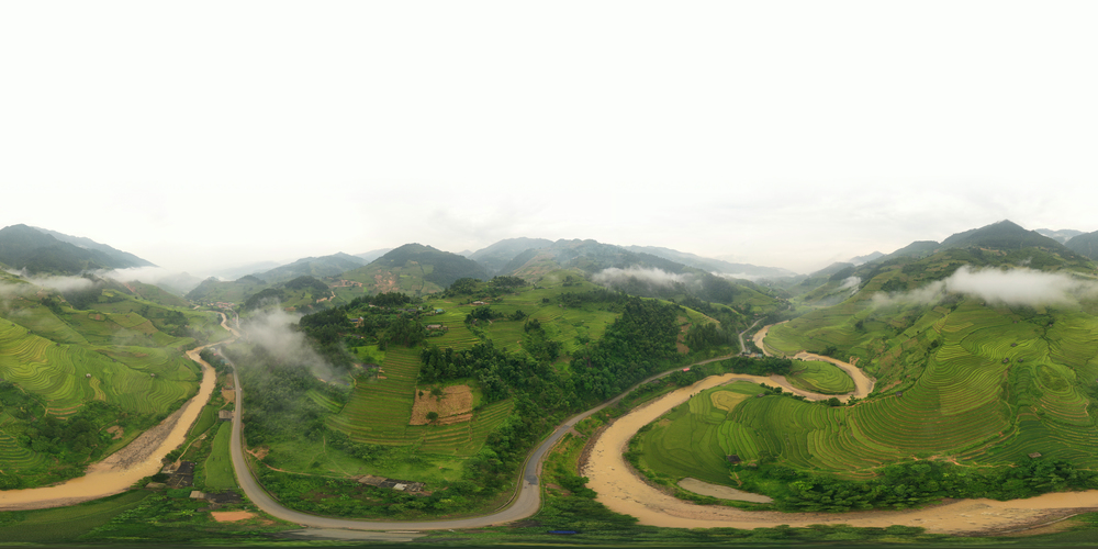 360 panorama by 180 degrees angle seamless panorama view of paddy rice terraces, green agricultural fields in rural area of Mu Cang Chai, mountain hills valley in Vietnam. Nature landscape background.