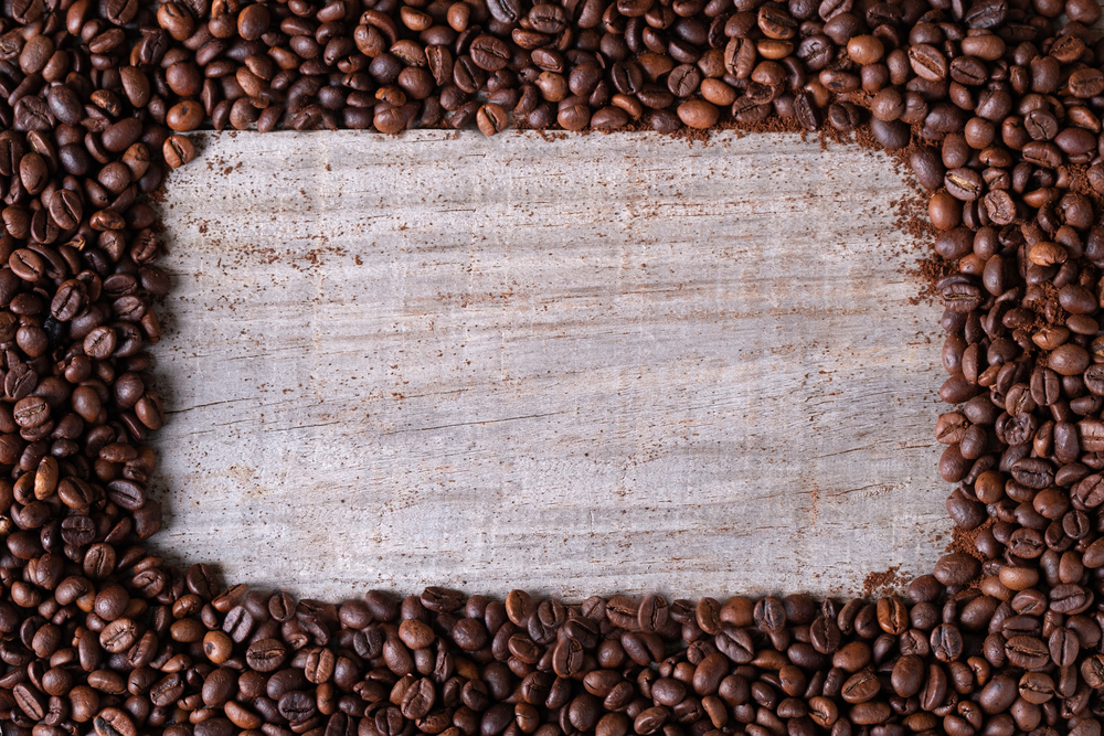 coffee beans background, in the middle wooden table