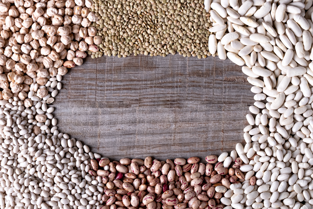 background of distant legumes on wooden board