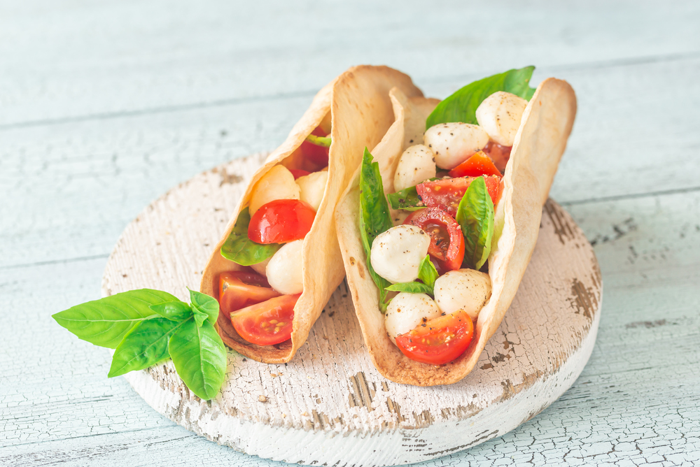 Caprese tacos on the wooden board