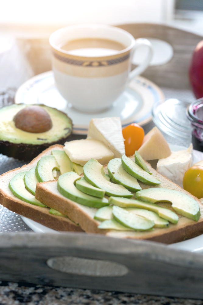delicious French breakfast. a cup of coffee and avocado sandwiches