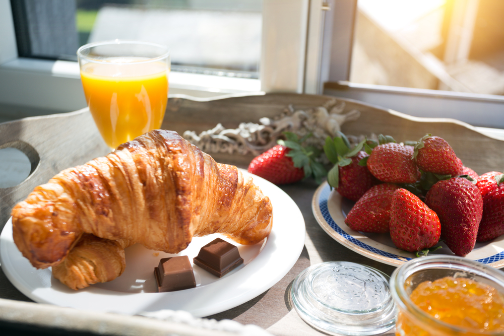 delicious French breakfast with a view of the castle. strawberries and croissants for breakfast