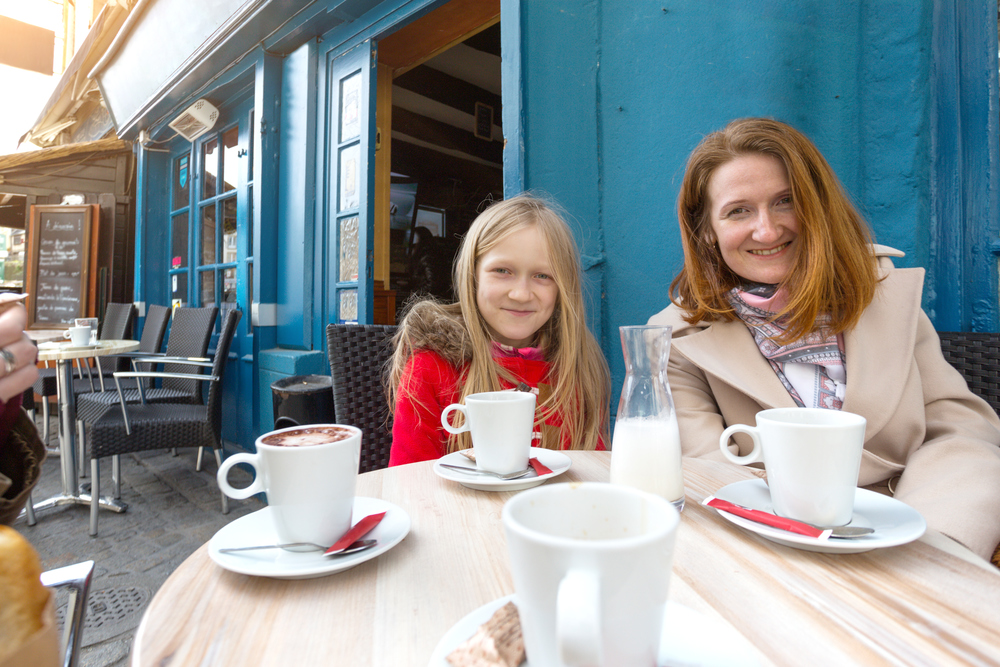 mother and daughter at the traditional french caffee. Morlaix, France