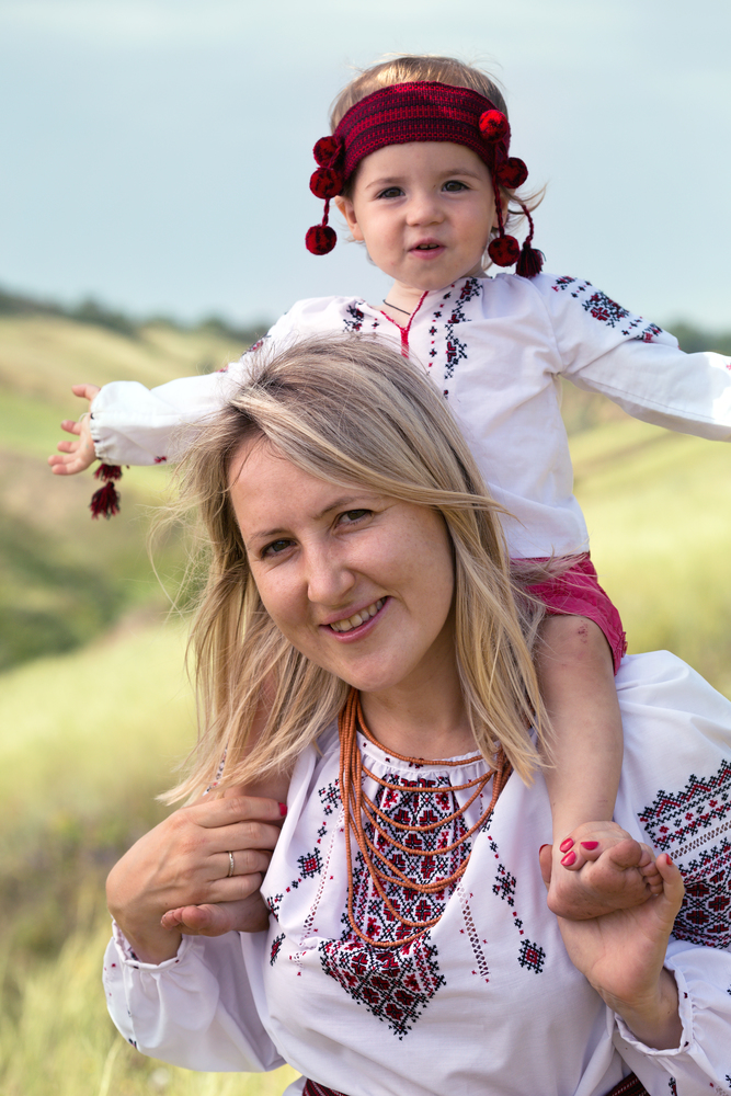 Ukrainian family at the  outdoor. mom and daughter in traditional national clothes vyshivanka