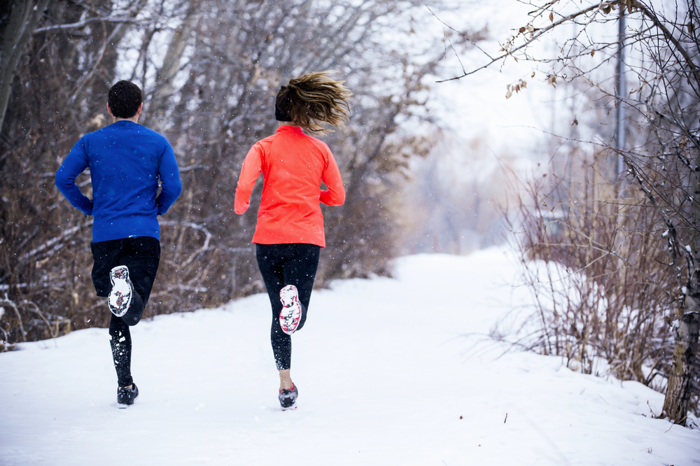 Couple running at winter morning