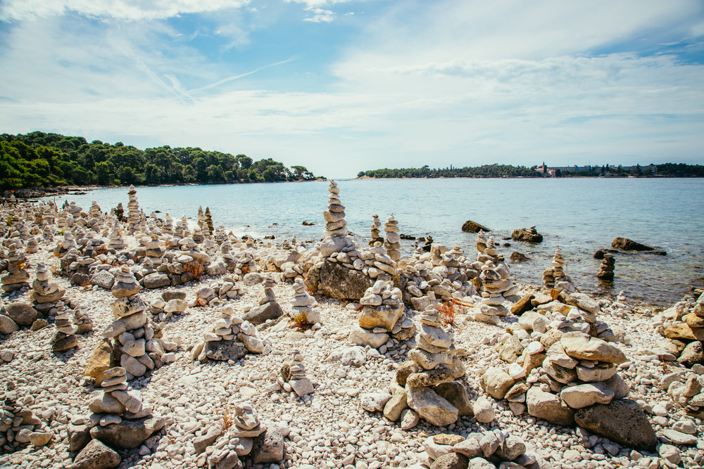 Spiritual cairns at the coast of Croatia, ocean