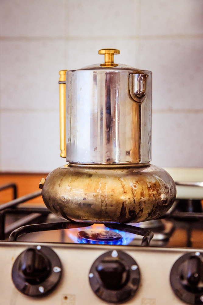 Italian coffee cooker on gas stove, breakfast