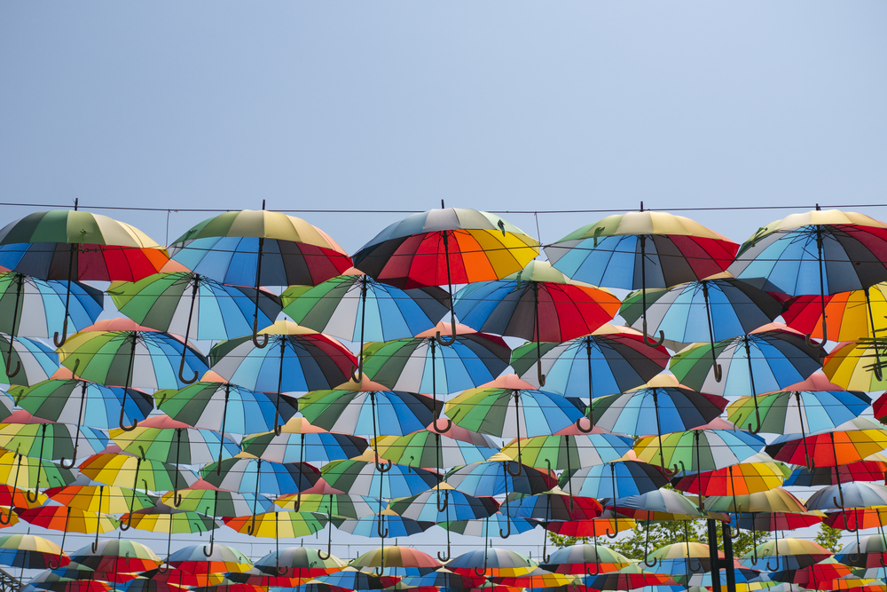 colorful umbrellas float in the air