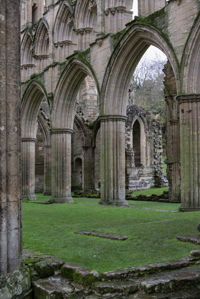 Remains of English ruin of an abbey with single columns arch