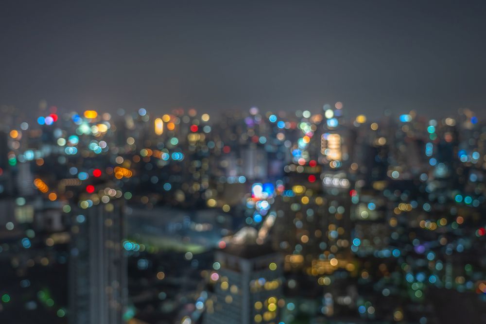 Abstract Photo blurred bokeh of bangkok cityscape at twilight time, background concept