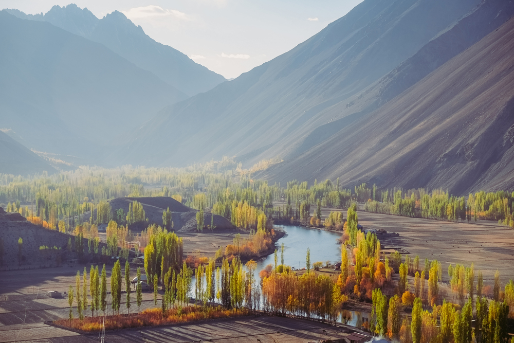 Peaceful and quiet nature landscape view of small village in Phander valley against Hindu Kush mountain range, Ghizer. Autumn season in Gilgit Baltistan, Pakistan.
