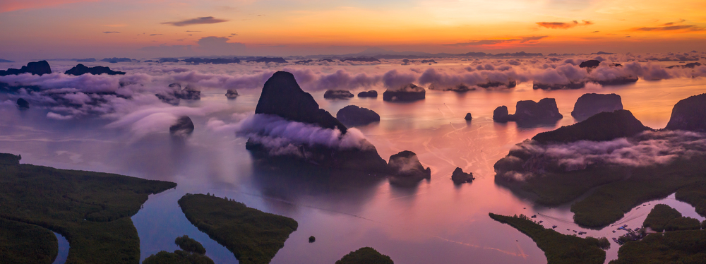 Aerial view Phang Nga Bay at sunrise with Beautiful limestone and mangrove tree forest and hills in the Andaman sea, Sametnangshe, Phang Nga, Thailand.