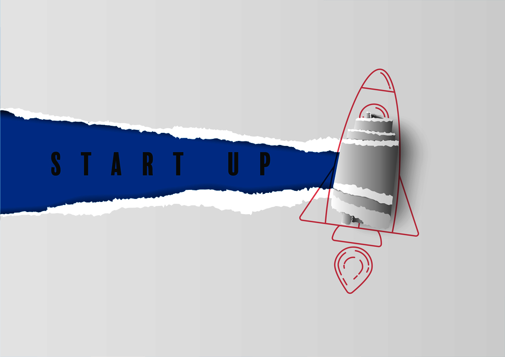 Torn paper edge on rocket with text start up. Business concept and exploration idea,
