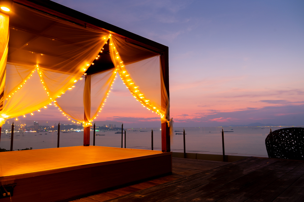 Beach daybed tent at sunset