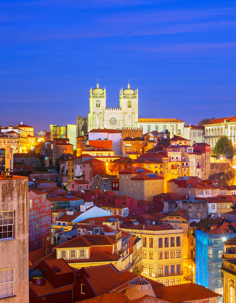 View of Ribeira with famous Porto Cathedral at night , Portugal