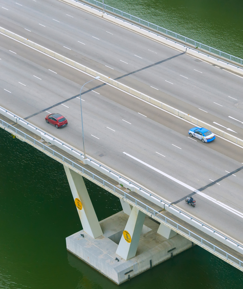 Top view of cars driving by modern bridge highway, Singapore