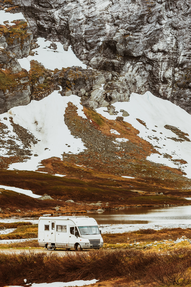 Tourism vacation and travel. Camper van and mountains landscape in Norway. Camper car in norwegian mountains
