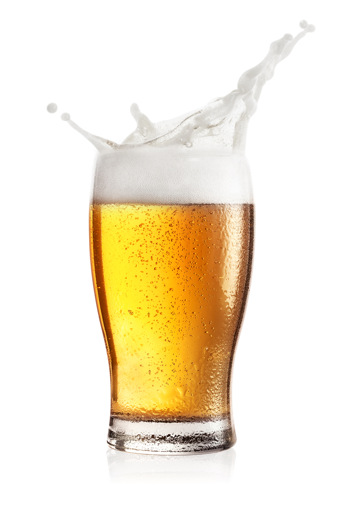 Steamed glass of light beer with splash isolated on white background. Steamed glass of light beer with splash