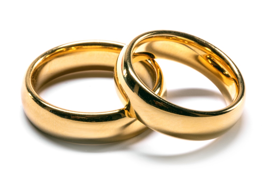 Golden wedding rings isolated on the white background. Golden wedding rings isolated