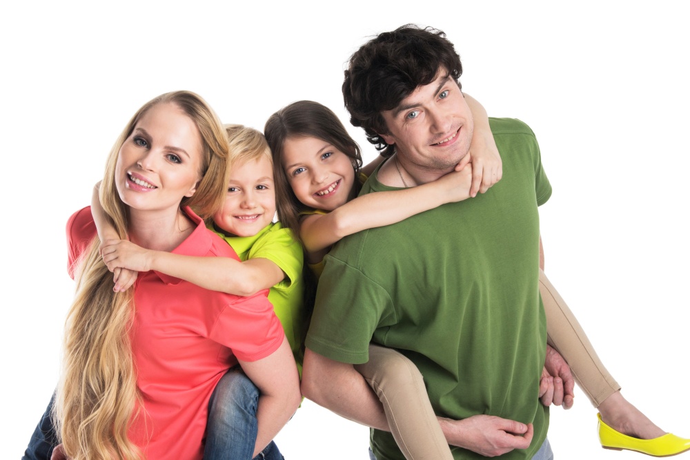 Studio portrait of family in colorful clothes with two children isolated on white background. Portrait of family with children