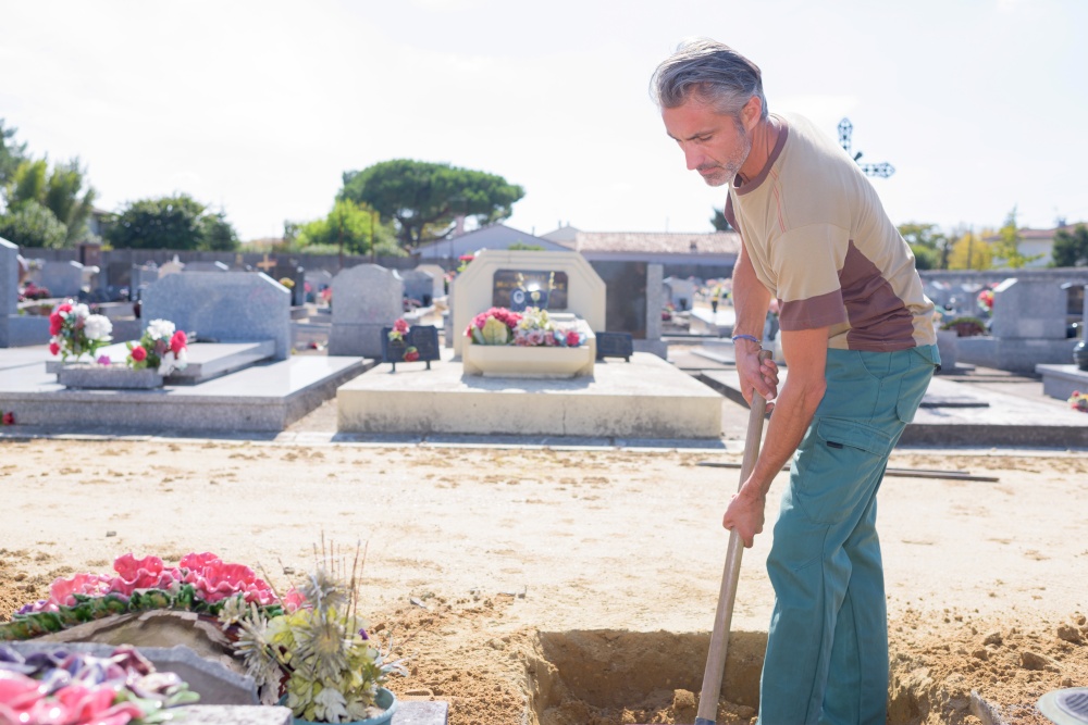 a man is digging grave