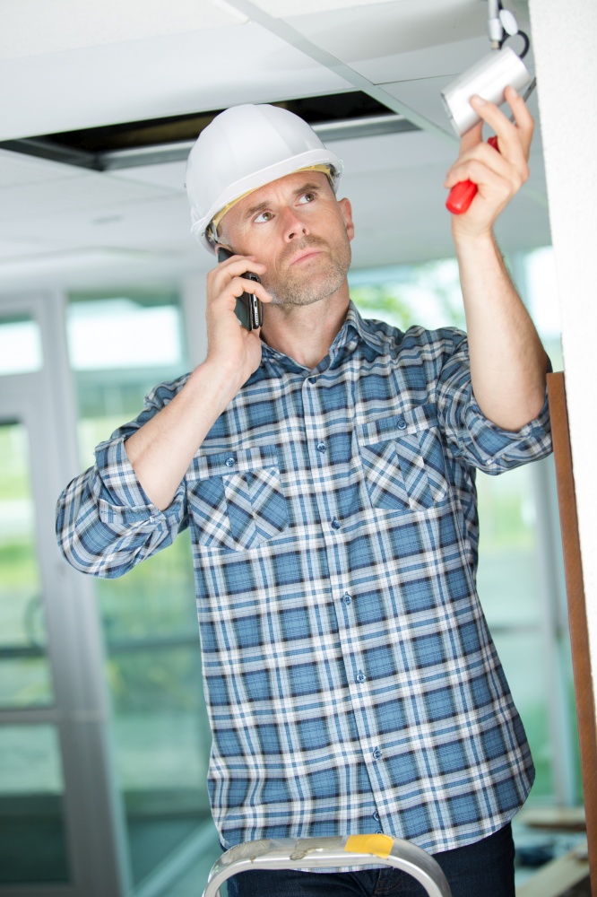 professional cctv technician installing security camera