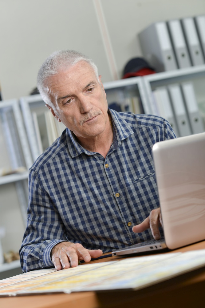 Architect sat working at his desk