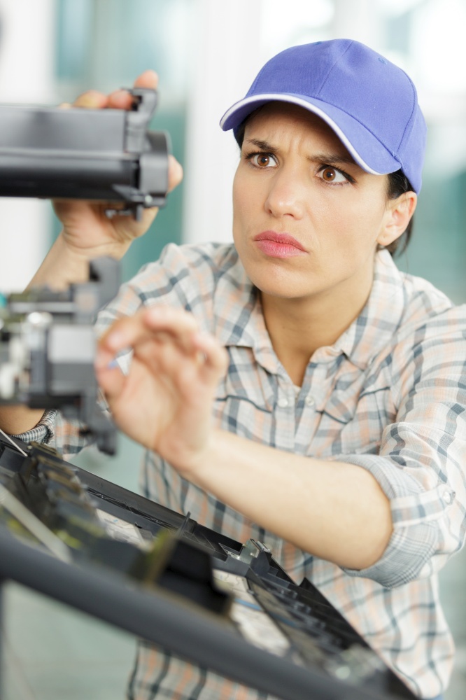 young woman engineer working at machine tool manufacturing