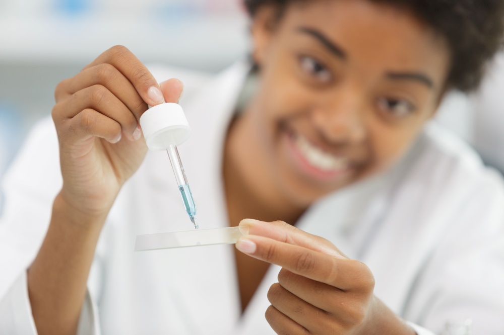 close-up face of woman with pipette