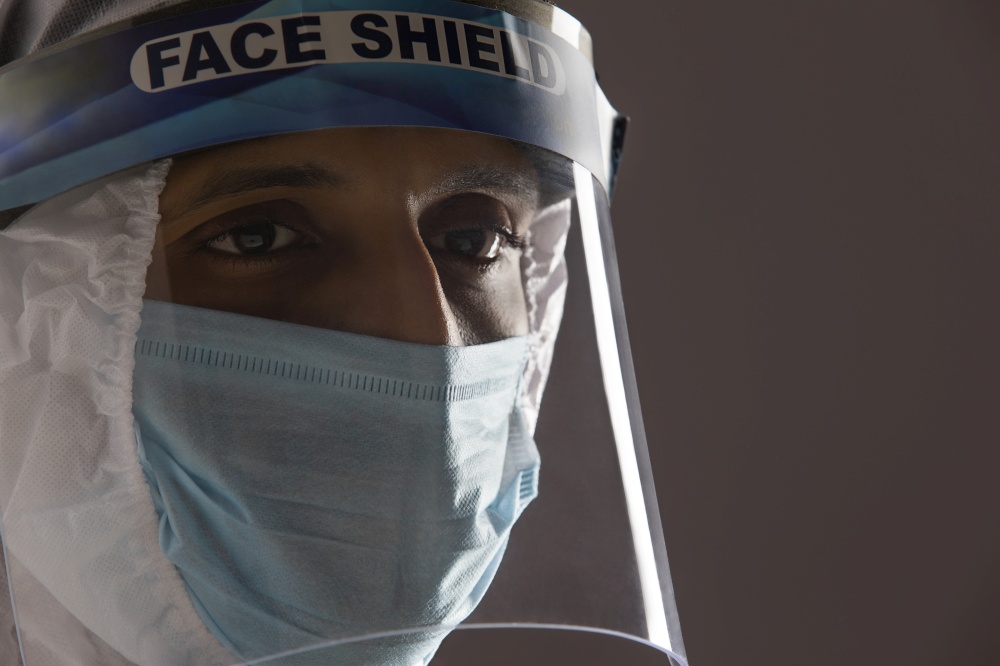 Close up of a doctor in a protective suit at the time of covid