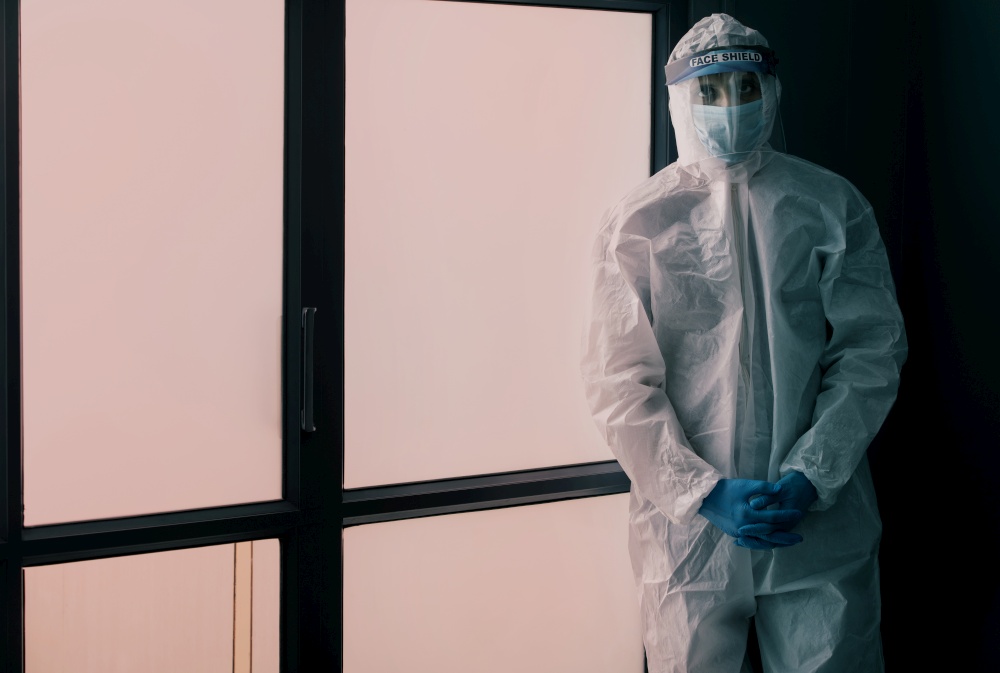 Doctor standing in a protective suit