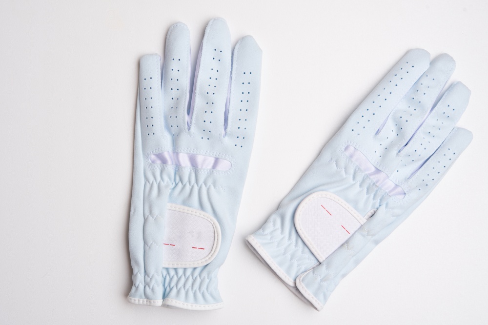 light blue horse riding gloves for Equestrian sports at white background