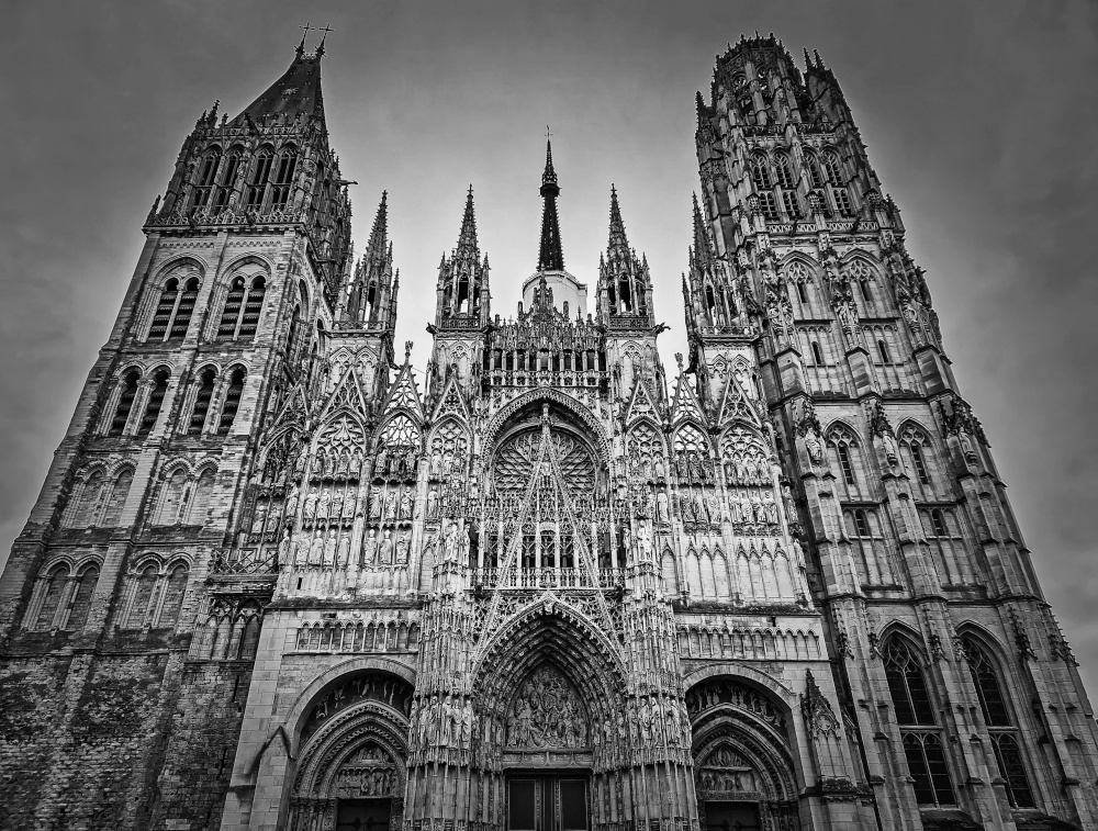Outdoor facade view of Notre Dame de Rouen Cathedral in the Normandy, France. Architectural landmark black and white view