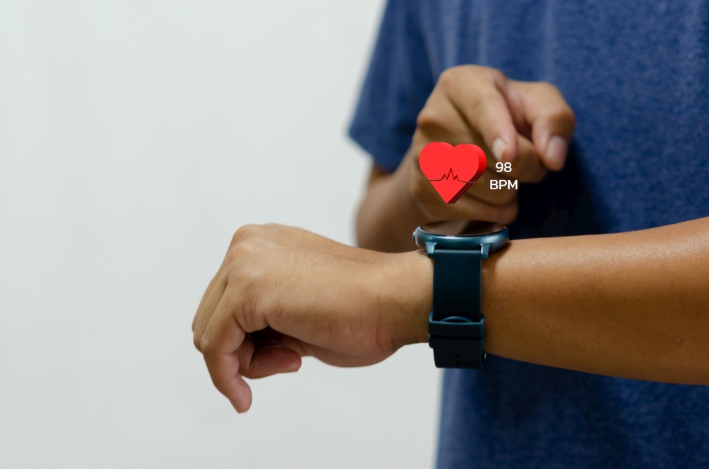 man using smart watch with icon heart red health care concept.