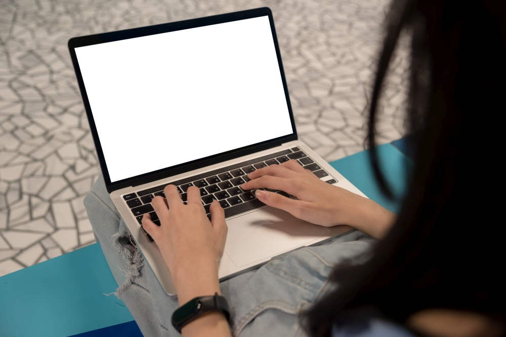 women using laptop computer mockup image blank screen working marketing and creative design.