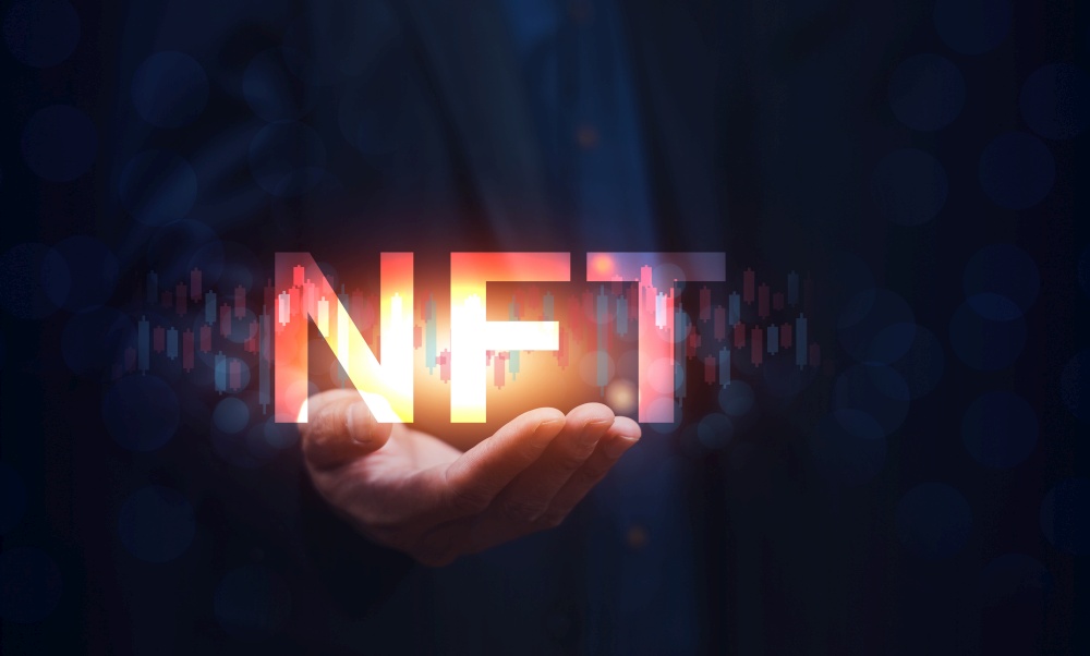 Hand holding NFT new trend 2022 for future investment