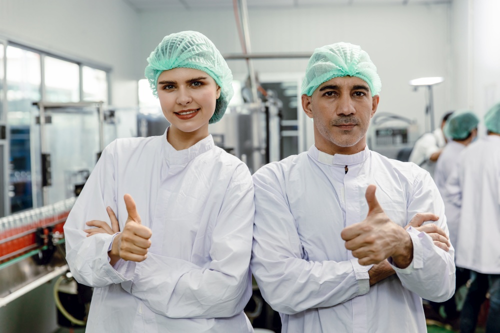 Portrait of food factory worker male and female thumbs up happy enjoy working with clean hygiene dressing. good quality products guarantee concept.