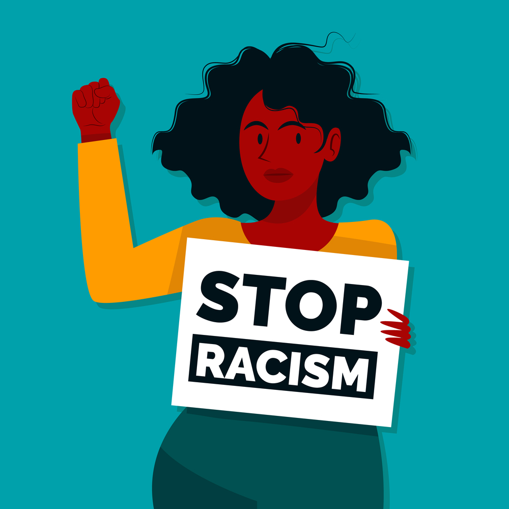 Young woman holding a placard with stop racism message